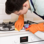 portrait man cleaning his house